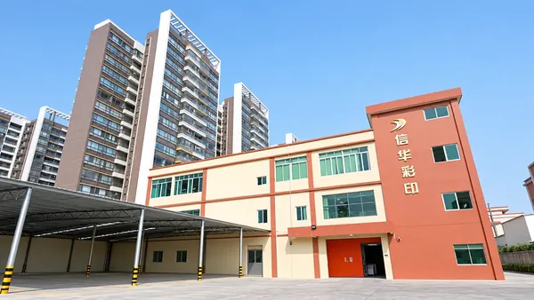 Xinhua Color Printing factory building in Enping with its red rooftop sign